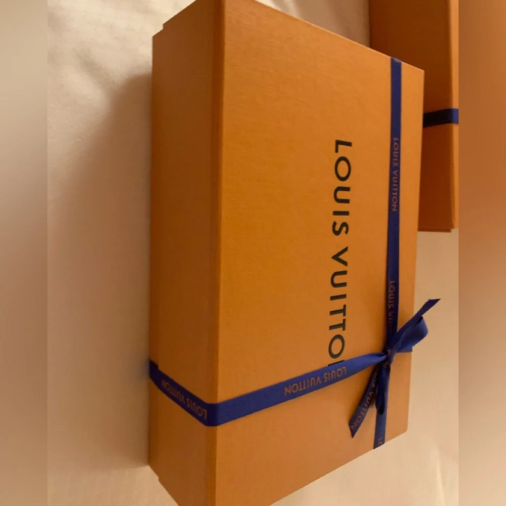 Brand new authentic smaller Luis Vuitton box with ribbon . Must have for closet!